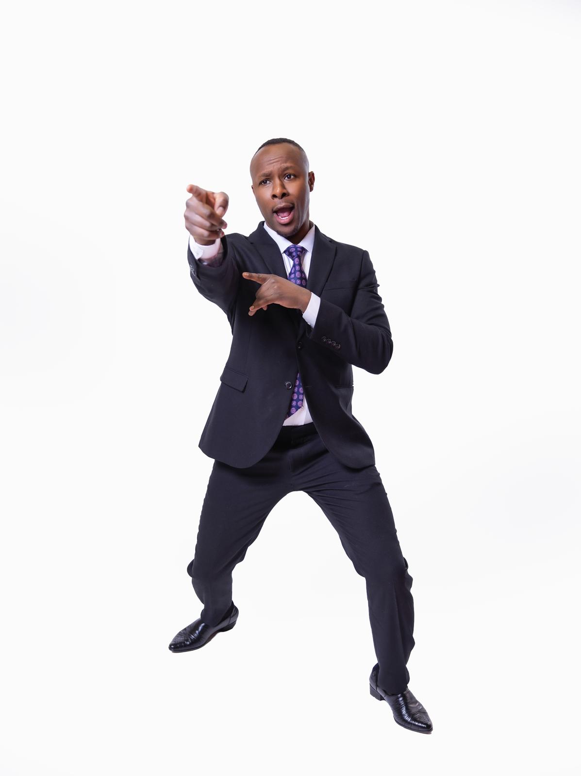 David Babu pointing and performing on stage